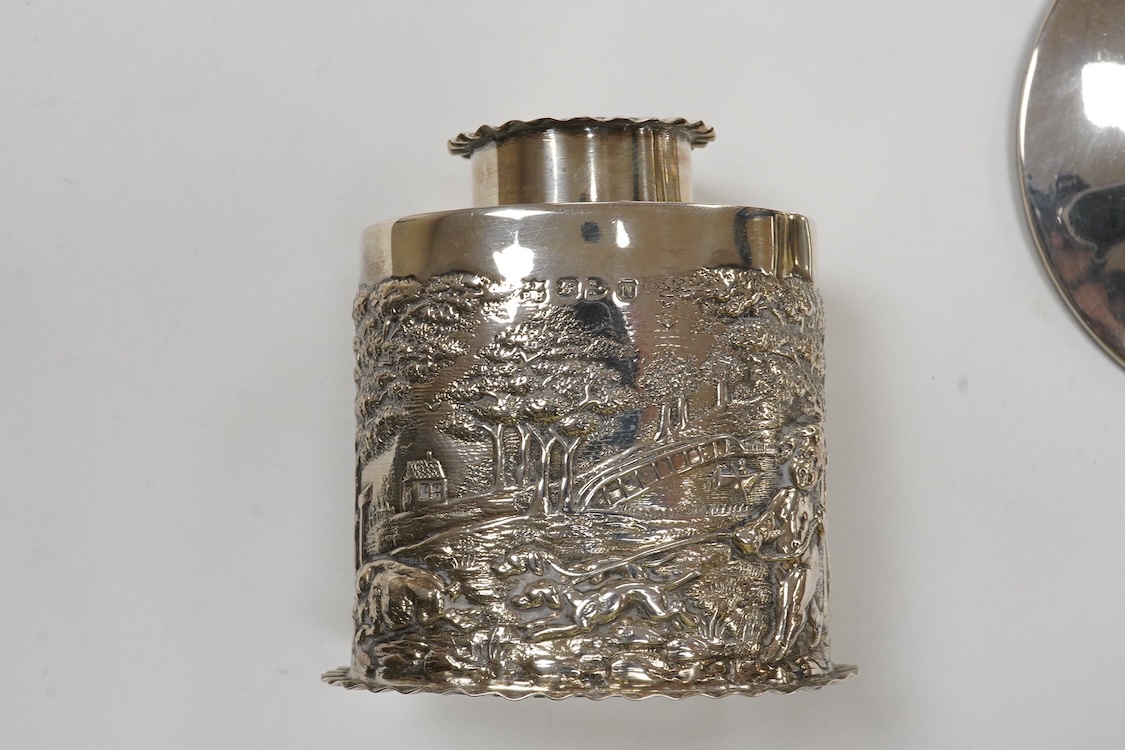 A late Victorian repousse silver oval tea caddy, by Nathan & Hayes, Chester, 1896, height 75mm, together with a George V silver mounted capstan inkwell.